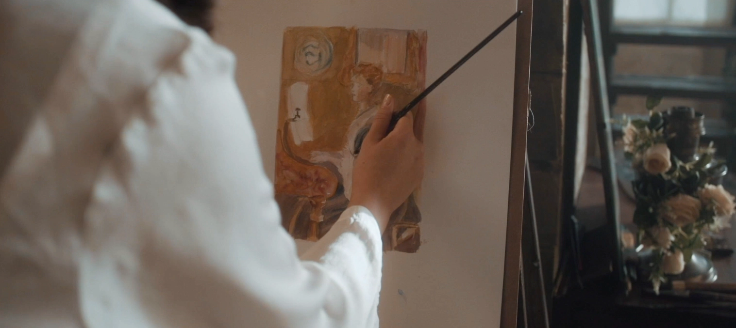 An artist painting on a canvas