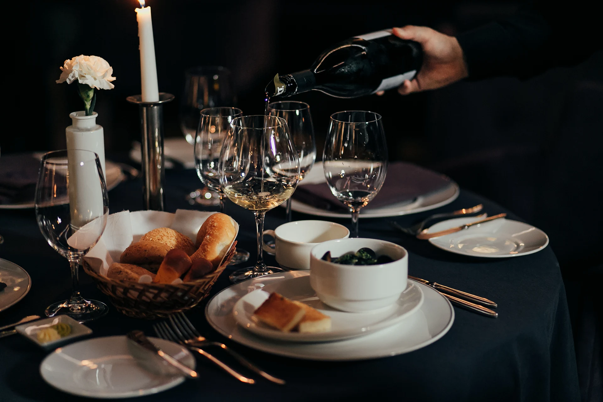 Table with food, glasses and wine